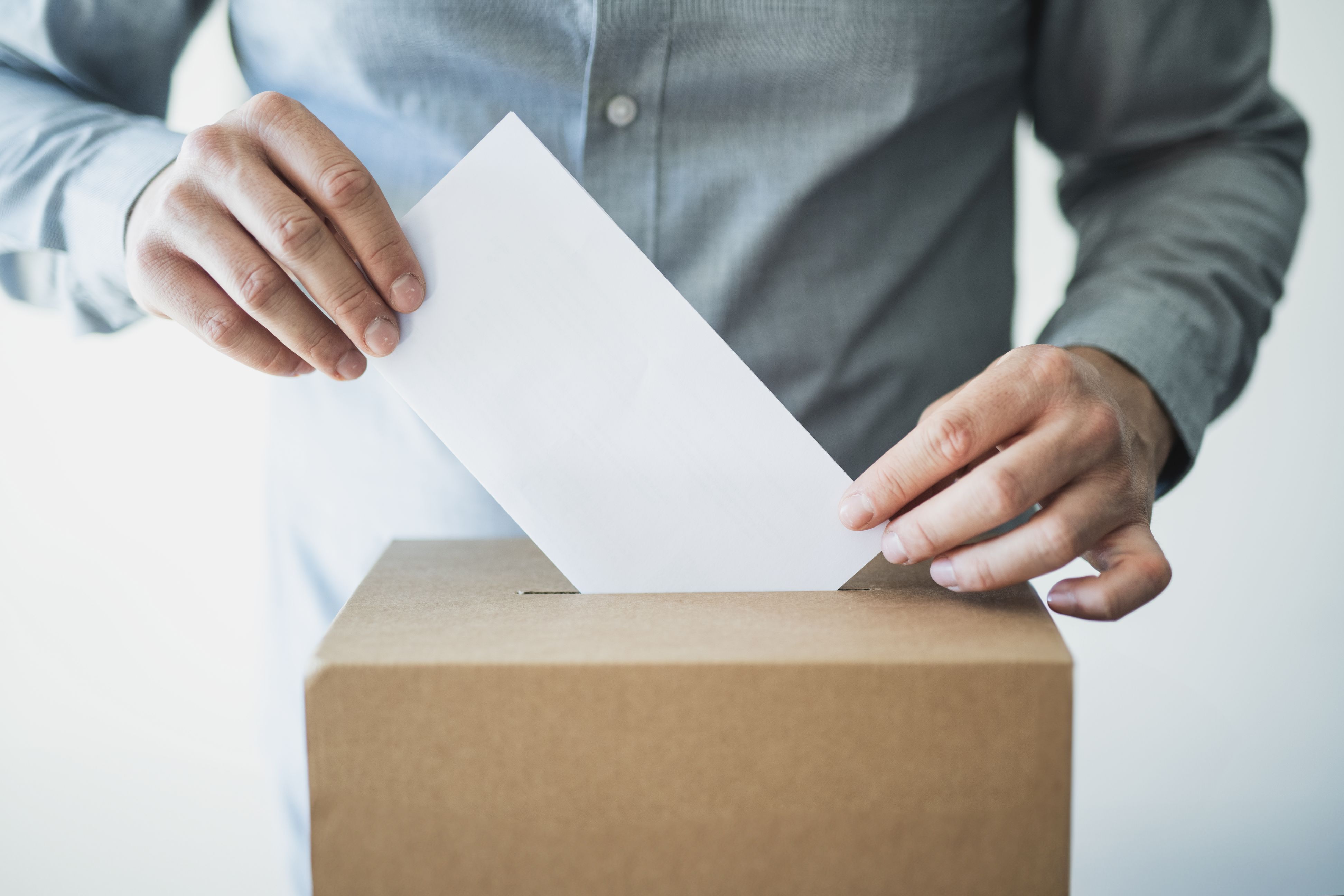 Hand of unrecognisable person Voting in ballot box in election day. Hand of unrecognisable person Voting in ballot box in election day.
